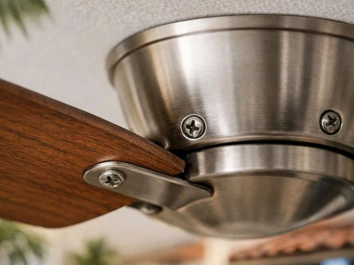 Electrician checking wiring beneath a ceiling fixture